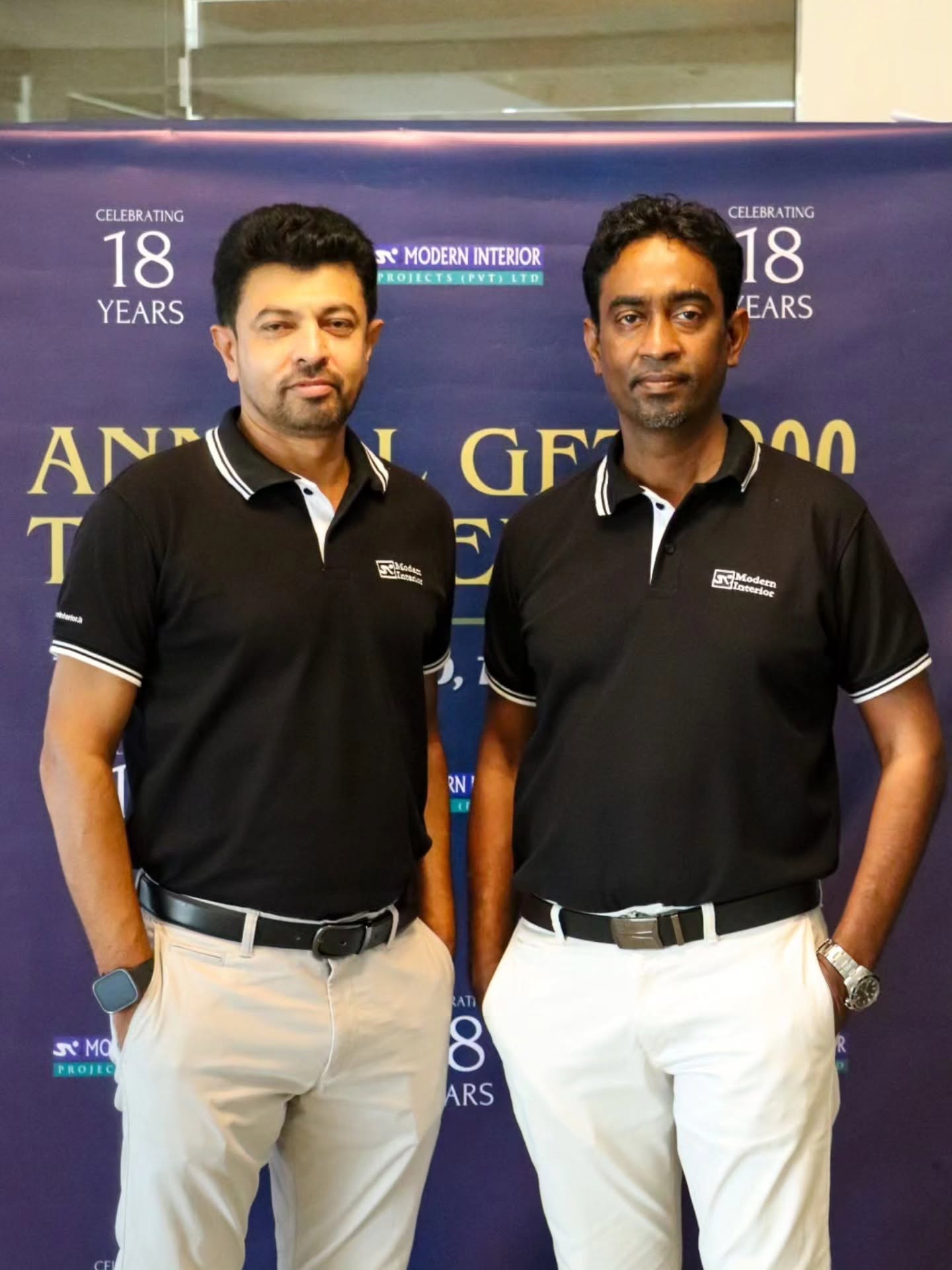 Modern Interior Projects directors in custom black Mezzo polos with white tipping and embroidered logo