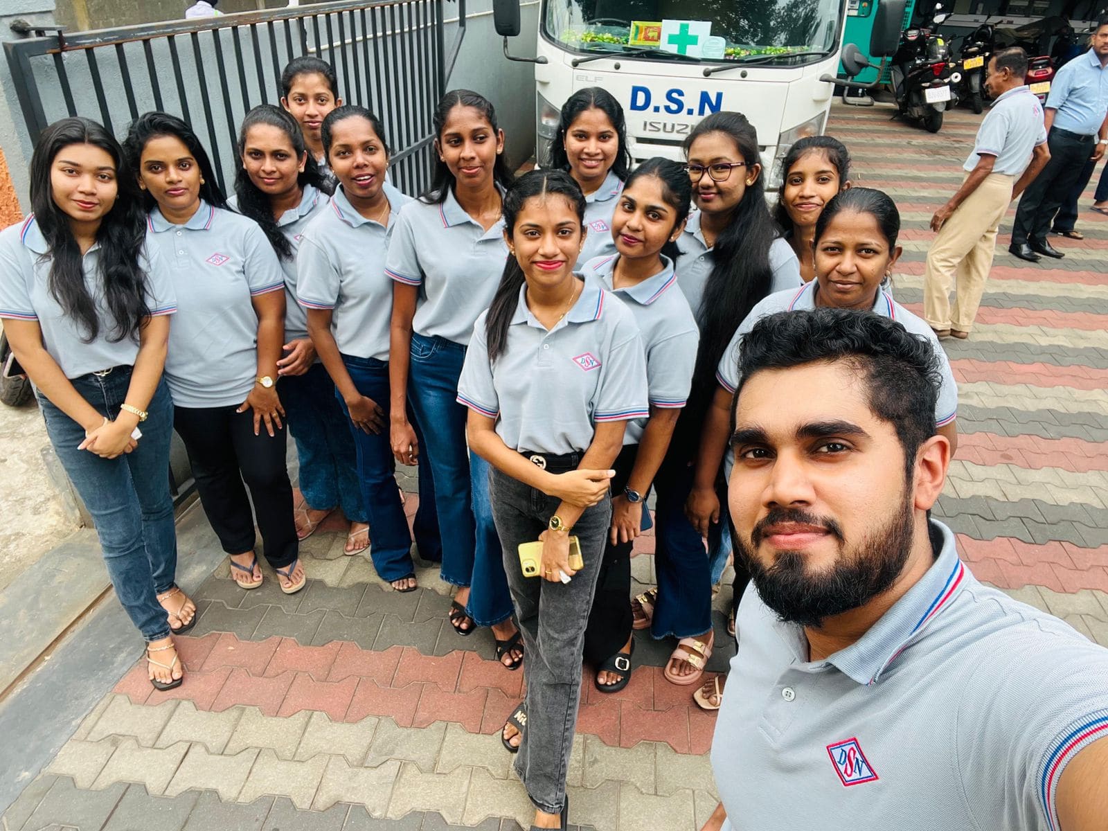 D.S.N. Enterprises ladies team in pale blue polos with red and blue tipping and embroidered crest