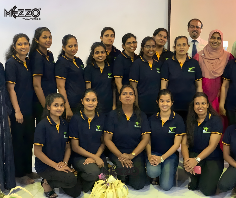 Mezzo Clothing in-house team in navy polos with yellow trim and embroidered logo