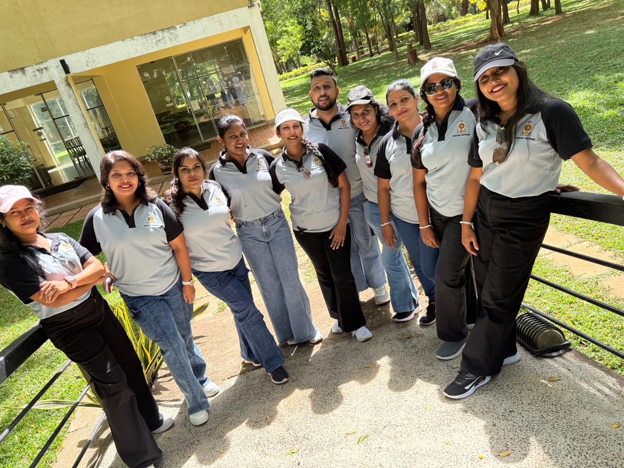 National Heritage department team in two-tone grey and black polos