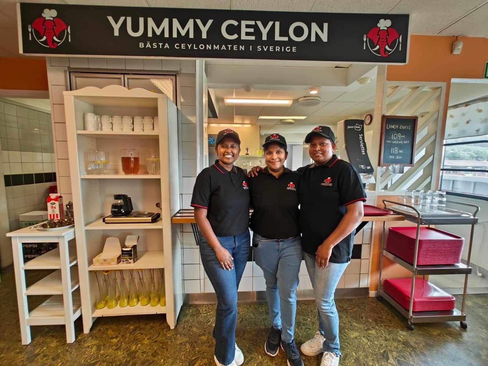 Yummy Ceylon staff in Sweden wearing custom Mezzo black polos with red trim and embroidered logo